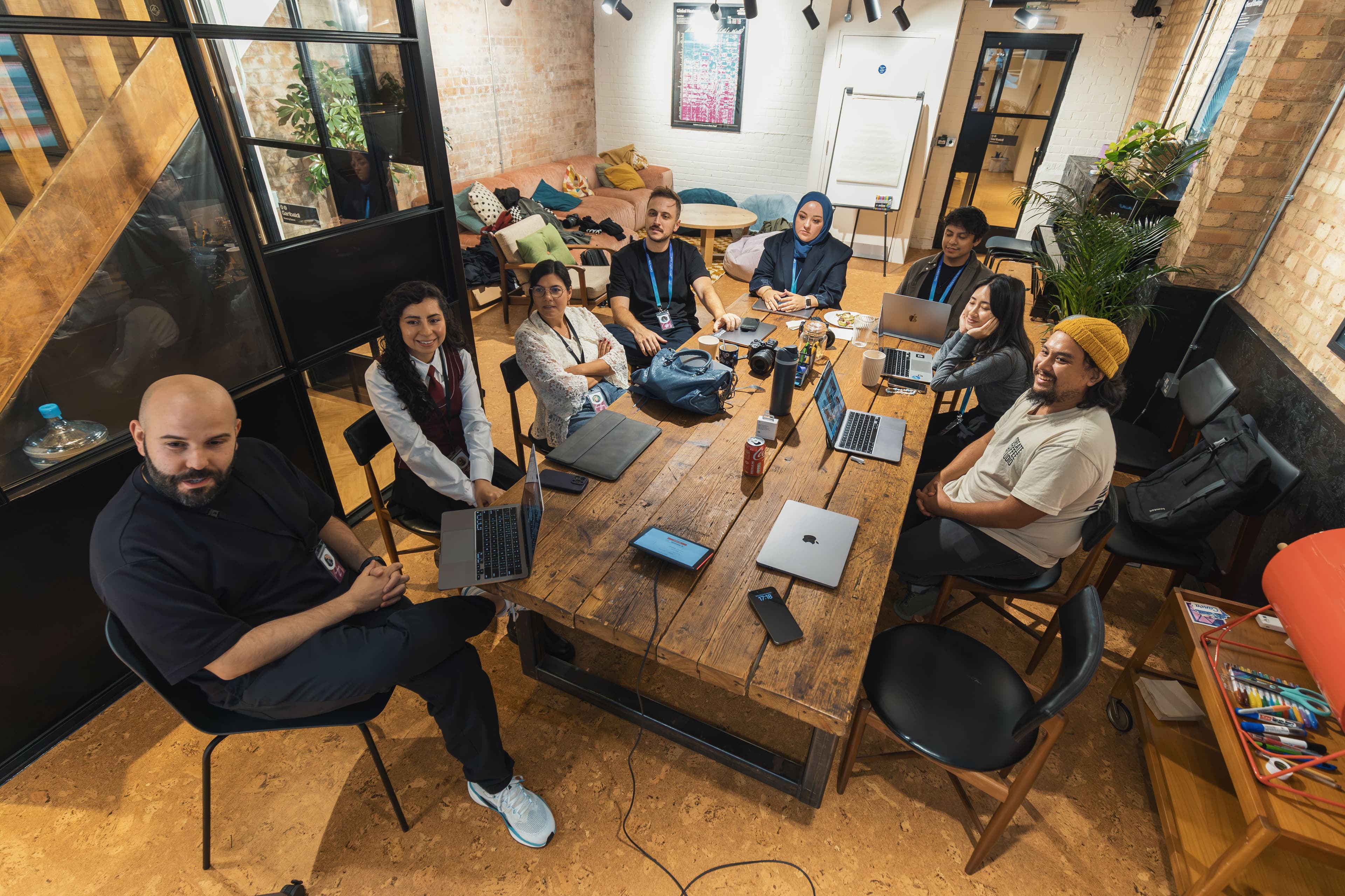 A hiring team in discussion over a shortlist